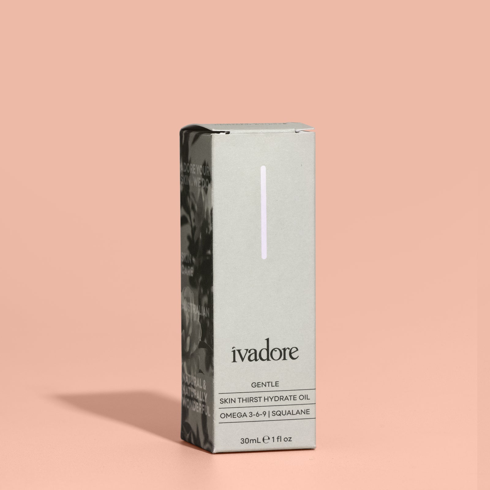 Close up Ivadore gentle face oil in glass bottle, glass pippette above bottle shows oil droplet