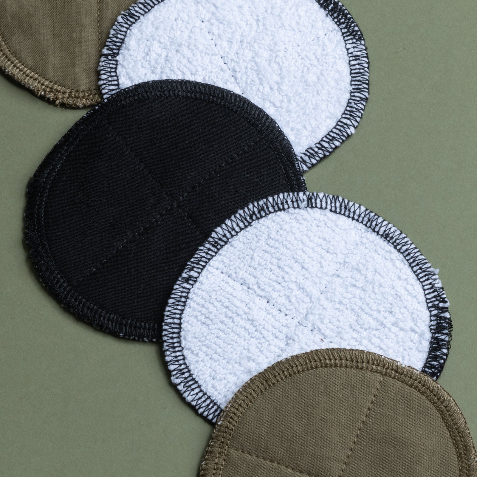 Close up of  Washable Facey Wipes showing different colours and each side of the reusable cloth